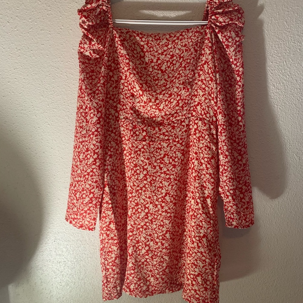 Red floral dress with ruffles on the shoulders